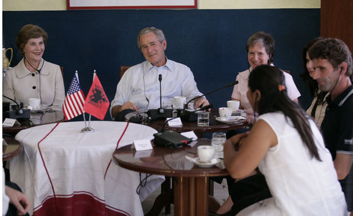 President George W. Bush and Mrs. Laura Bush participate in a roundtable discussion at Cafe Cela in Fusche Kruje, Albania, Sunday, June 10, 2007, on the USAID Micro-Lending Program. Said the President, "Laura and I thank the Mayor, we thank the owner of the restaurant, and we thank these entrepreneurs for joining us to talk about your story, about your dreams, and about the opportunities a micro-loan program, provided by the taxpayers of the United States, is giving you to create jobs." White House photo by Eric Draper