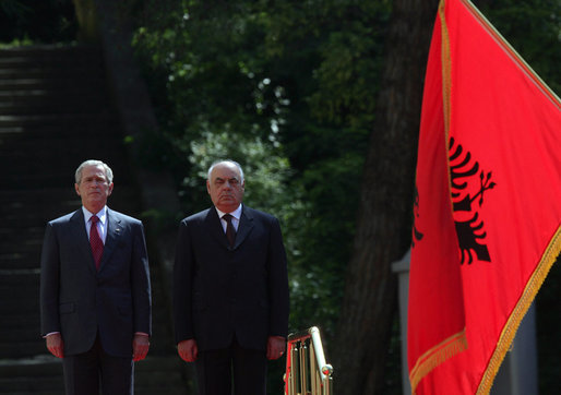 President George W. Bush stands next to President Alfred Moisiu of Albania, during arrival ceremonies Sunday, June 10, 2007, in Tirana, Albania. White House photo by Chris Greenberg