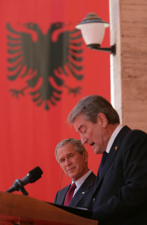 President George W. Bush listens to an interpretation of the remarks by Albania's Prime Minister Sali Berisha during a joint press availability Sunday, June 10, 2007, in Tirana, Albania. The visit marked the first to the country by a sitting president and came on the second to the last day of a seven-day, European tour. White House photo by Chris Greenberg