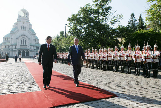 President George W. Bush and Bulgarian President Georgi Parvanov walk along a red carpet in Nevsky Square in Sofia, Bulgaria, Monday, June 11, 2007, during the official welcome for President Bush and Mrs. Laura Bush. White House photo by Eric Draper