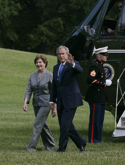 President George W. Bush and Mrs. Laura Bush return to the White House Monday afternoon, June 11, 2007, following their six-nation visit, including attending the G8 Summit. White House photo by Joyce Boghosian