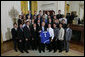 President George W. Bush stands with members of the University of California, Santa Barbara Men's Soccer 2006 Championship Team Monday, June 18, 2007 at the White House, during a photo opportunity with the 2006 and 2007 NCAA Sports Champions. White House photo by Eric Draper