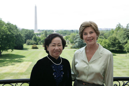 Mrs. Laura Bush and Madame Chi, wife of Vietnam President Nguyen Minh Triet, pose for a photo Friday, June 22, 2007 on the Truman Balcony, during Madame Chi's visit to the White House. White House photo by Chris Greenberg