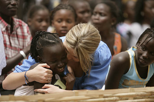 Ms. Jenna Bush hugs a little girl who danced during a performance Tuesday, June 26, 2007, by musician Youssou N'Dour for the children at Grand Medine Primary School in Dakar, Senegal. White House photo by Shealah Craighead