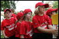 Members of the Luray, Virginia Red Wings watch from the bench Wednesday, June 27, 2007, during the first White House Tee Ball Game of the 2007 season as they go against the Bobcats from Cumberland, Maryland, on the South Lawn of the White House. White House photo by Chris Greenberg