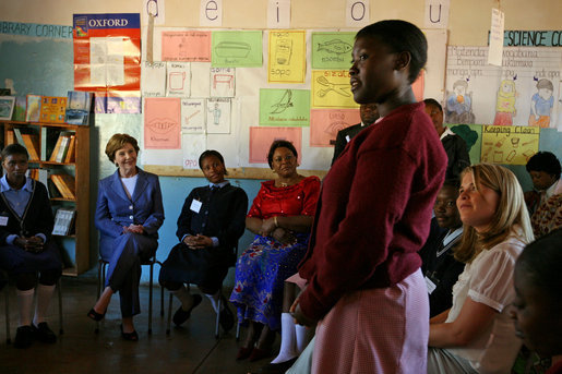Mrs. Laura Bush and Ms. Jenna Bush meet with educators and student at Regiment Basic School Thursday, June 28, 2007, in Lusaka, Zambia. Of the 1,200 students at the school, 300 are orphans. After meeting with the students and watching skits and song performances, Mrs. Bush addressed the press saying, "I just met with a group of girls who are receiving scholarships, some of them are orphan girls, orphans because their parents died of AIDS, and they're receiving scholarships from PEPFAR, the President's Emergency Plan for Aids Relief." White House photo by Shealah Craighead