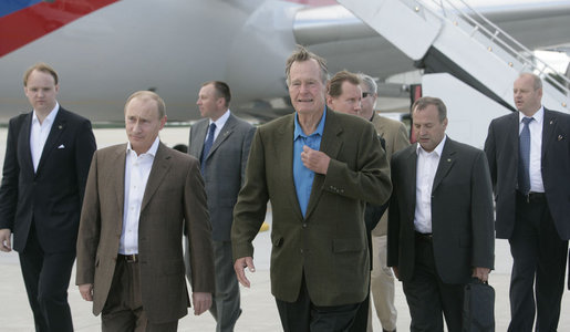 Former President George H.W. Bush leads the way for Russian President Vladimir Putin Sunday, July 1, 2007, after his arrival in the United States at Pease Air National Guard Base in Portsmouth, N.H. White House photo by Joyce N. Boghosian