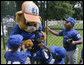 Players from the Inner City Little League of Brooklyn, N.Y. give a group hug to Dugout, the Little League mascot Sunday, July 15, 2007 at the White House Tee Ball Game, played in honor of baseball legend Jackie Robinson between Inner City and the Wrigley Little League Dodgers of Los Angeles. More about Tee Ball on the South Lawn. White House photo by Joyce N. Boghosian