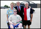 President George W. Bush poses for a photo with Army National Guard Sgt. James Kevin Downs and his parents Joe and Cathy Downs of Kingston Springs, Tenn., on his arrival Thursday, July 19, 2007 to Nashville International Airport. President Bush first met Sgt. Downs at the Brooke Army Medical Center in January 2006, where Downs was recovering from severe injuries caused during a bomb and rocket attack in Iraq in August 2005. White House photo by Chris Greenberg