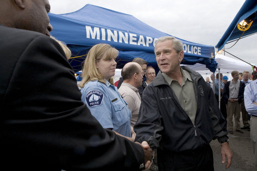 President George W. Bush greets and thanks Minneapolis-St. Paul first responders, National Transportation Safety Board personnel, Minneapolis Police and Fire/Rescue teams, and American Red Cross Twin Cities Area Chapter staff and volunteers, for their hard work at the scene of the I-35W bridge collapse Saturday, Aug. 4, 2007 in Minneapolis. White House photo by Chris Greenberg