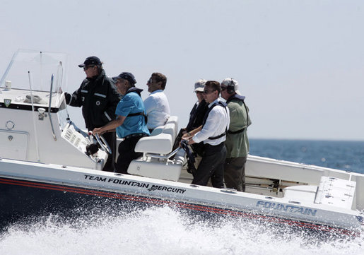 President George W. Bush and President Nicolas Sarkozy of France ride in a boat driven by former President George H. W. Bush during a visit to Walker’s Point Saturday, August 11, 2007, in Kennebunkport, Maine. White House photo by Joyce N. Boghosian