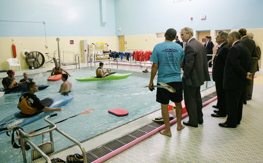 President George W. Bush speaks with Joe Mornini, left, founder of Team River Runner, during the President’s visit Monday, Aug. 13, 2007 to the Washington, D.C. Veterans Affairs Medical Center indoor pool, where recuperating wounded veterans use kayaks to learn and increase their mobile skills. Team River Runner is an all-volunteer organization established in 2004 by kayakers in the Washington area that uses recreation rehabilitation through aquatic therapy activities. White House photo by Chris Greenberg