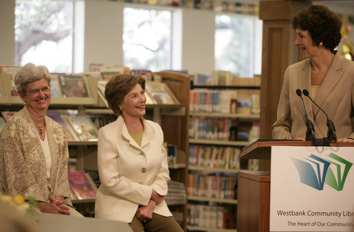 Mrs. Laura Bush is introduced by Texas Comptroller Susan Combs during a visit Tuesday, August 14, 2007, to the Westbank Community Library in Austin, where the construction of the Laura Bush Community Library was announced. The library will be the first public library in the United States to be named for Mrs. Bush, a former teacher and librarian. Joining them is Beth Fox, head librarian at the Westbank library. White House photo by Shealah Craighead