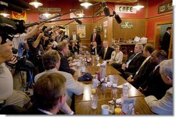 President George W. Bush talks with members of the media during his breakfast meeting with community leaders at the Corner Cafe in Riverside, Mo., Wednesday, Aug. 22, 2007. White House photo by Chris Greenberg