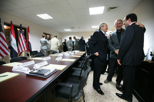 President George W. Bush greets Iraqi Prime Minister Nouri al Maliki, right, before the start of his meeting with the Iraqi National Leadership at Al Asad Airbase, Al Anbar Province, Iraq, Monday, September 3, 2007. White House photo by Eric Draper