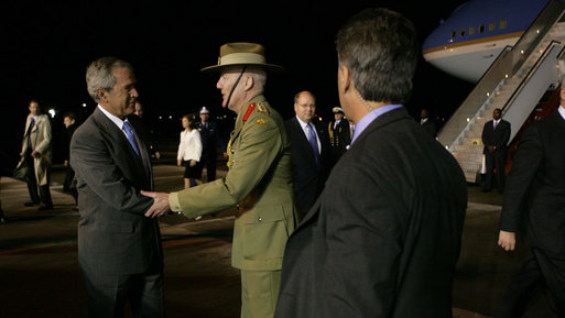 President George W. Bush is greeted Tuesday, Sept. 4, 2007, upon his arrival at Sydney (Kingsford-Smith) Airport by Colonel Bil Monfrieds ADC, representing the Governor-General of Australia. White House photo by Eric Draper