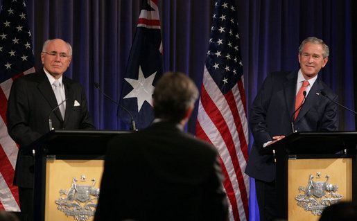 President George W. Bush and Prime Minister John Howard of Australia, listen to a reporter's question Wednesday, Sept. 5, 2007, during a joint press availability at the InterContinental Hotel in Sydney. President Bush met with the Prime Minister for a day's worth of meetings before joining him during the 2007 APEC summit later in the week. White House photo by Eric Draper