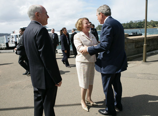 President George W. Bush greets Mrs. Janette Howard at the Man O War Steps Wharf in Sydney Wednesday, Sept. 5, 2007. The President joined Mrs. Howard and Prime Minister Howard for a social lunch with Australian troops. White House photo by Eric Draper