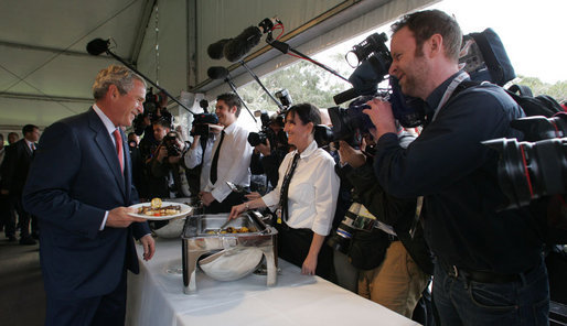 President George W. Bush smiles as he greets a young lady during a luncheon Wednesday, Sept. 5, 2007, on Garden Island in Sydney. White House photo by Chris Greenberg
