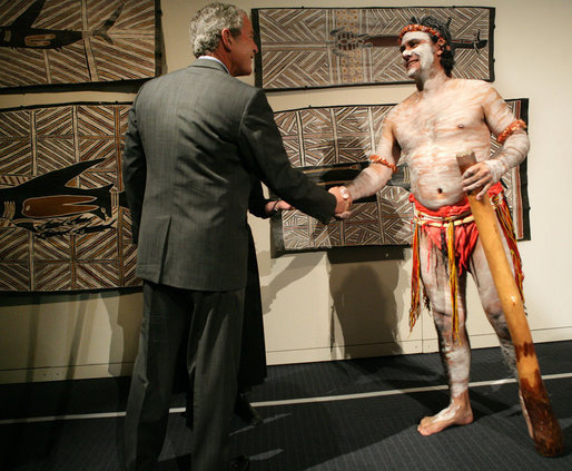 President George W. Bush greets a performer Thursday, Sept. 6, 2007, during a brief exhibition of Aboriginal dance and song at the Australian National Maritime Museum in Sydney. White House photo by Eric Draper