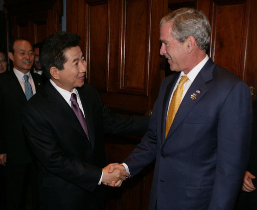 President George W. Bush welcomes President Roh Moo-hyun of the Republic of Korea, to a meeting Friday, Sept. 7, 2007, at the InterContinental hotel in Sydney. President Bush told his counterpart, ".When we have worked together, we have shown that it's possible to achieve the peace on the Korean Peninsula that the people long for. So thank you, sir." White House photo by Eric Draper