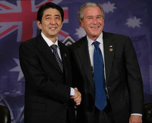 President George W. Bush and Prime Minister Shinzo Abe of Japan, shake hands following their meeting Saturday, Sept. 8, 2007, in Sydney. The President thanked the Prime Minister for his support in the war on terrorism, saying, "The fact that we’re in a war against extremists was heightened today by the release of a tape. The tape is a reminder about the dangerous world in which we live, and it is a reminder that we must work together to protect our people against these extremists." White House photo by Eric Draper