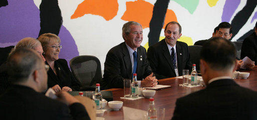 President George W. Bush smiles as he joins fellow APEC leaders during a dialogue Saturday, Sept. 8, 2007, with members of the APEC Business Advisory Council at the Sydney Opera House in Sydney, Australia. White House photo by Eric Draper