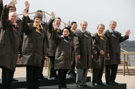 President George W. Bush and fellow APEC leaders don brown Drizabone coats as they pose for the official APEC portrait Saturday, Sept. 8, 2007, at the Sydney Opera House. White House photo by Eric Draper