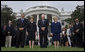 President George W. Bush, Mrs. Laura Bush, Vice President Dick Cheney and Mrs. Lynne Cheney bow their heads for a moment of silence on the South Lawn of the White House Tuesday, Sept. 11, 2007, in memory of those whose lives were lost on Sept. 11, 2001.  White House photo by Chris Greenberg