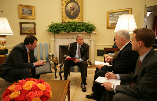 President George W. Bush goes over a draft of tonight's address to the nation with members of the White House speechwriting staff Thursday, Sept. 13, 2007, in the Oval Office. With him, from left, are: Marc Thiessen, Bill McGurn and Christopher Michel. White House photo by Eric Draper