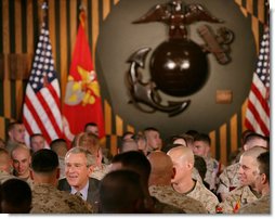 President George W. Bush talks with U.S. Marines during his lunch visit to The Basic School at Quantico Marine Corps Base Friday, Sept.14, 2007 in Quantico, Va. White House photo by Chris Greenberg