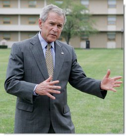 President George W. Bush gestures as he talks with members of the media following his lunch with U.S. Marines during his visit to The Basic School at Quantico Marine Corps Base Friday, Sept.14, 2007 in Quantico, Va. White House photo by Chris Greenberg