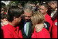 President George W. Bush consoles Ronald Klopf and Lisa West-Klopf, both of Aguanga, Calif., during a gathering of military support organizations Tuesday, Sept. 18, 2007, on the South Lawn. Their son, Lance Cpl. Jeromy West, was killed November of 2006 while serving with the U.S. Marines in Iraq. White House photo by Chris Greenberg