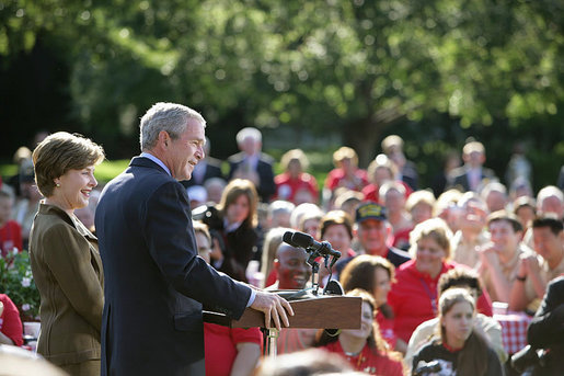 Standing with Mrs. Laura Bush, President George W. Bush addresses military support organizations Tuesday, Sept. 18, 2007, on the South Lawn. "Laura and I welcome the families who have got a loved one overseas, whether it be in Iraq or Afghanistan, fighting these extremists and terrorists," said President Bush. "The best way to honor your loved one is to make sure that he or she has the full support of the United States government as you accomplish the mission that we have set." White House photo by David Bohrer