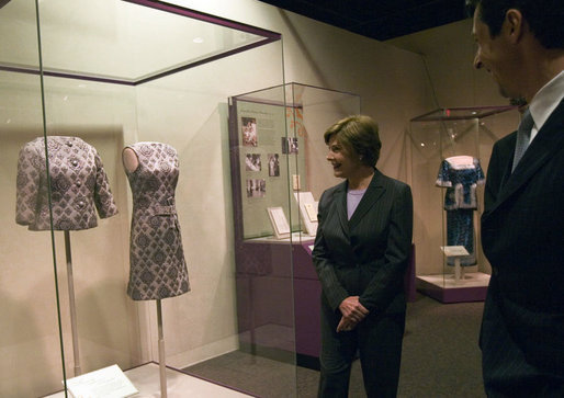 Mrs. Laura Bush looks at a dress worn by Jacqueline Kennedy during a tour of the exhibit First Ladies: Political Role and Public Image at the National Constitution Center Monday, Oct. 1, 2007, in Philadelphia. White House photo by Shealah Craighead