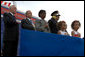 President Bush is accompanied in the Pledge of Allegiance by U.S. Representative Steny Hoyer, (D-Md.), (left), and the wife and children of firefighter Russell Schwantes of Fayetteville, Ga., during a ceremony at the National Fallen Firefighters Memorial in Emmitsburg, Md., Sunday, Oct. 7, 2007. White House photo by Chris Greenberg