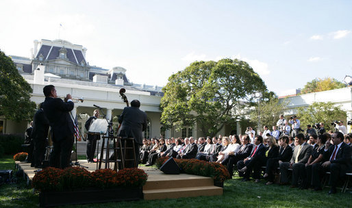 President George W. Bush and guests enjoy the entertainment of Cachao and his band during a Rose Garden celebration Wednesday, Oct. 10, 2007, of Hispanic Heritage Month. White House photo by Chris Greenberg