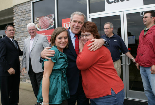 President George W. Bush is greeted outside the Whole Hog Cafe in Rogers, Ark., as he arrives for a lunch meeting with local business leaders Monday, Oct. 15, 2007. White House photo by Eric Draper
