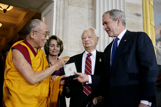 President George W. Bush, joined by U.S. Senator Robert Byrd and House Speaker Nancy Pelosi, presents the Congressional Gold Medal to The Dalai Lama at a ceremony Wednesday, Oct. 17, 2007 at the U.S. Capitol in Washington, D.C. White House photo by Chris Greenberg
