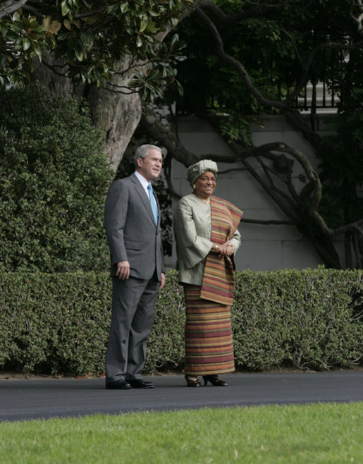 President George W. Bush shows President Ellen Johnson Sirleaf of the Republic of Liberia the view of the White House South Lawn and the monuments beyond, following their meeting Thursday, Oct. 18, 2007 in the Oval Office. President Sirleaf is Africa’s first elected female head of state. White House photo by Joyce N. Boghosian