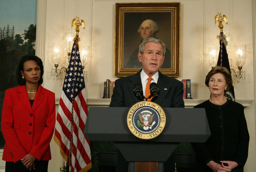 Flanked by Secretary of State Condoleezza Rice and Mrs. Laura Bush, President George W. Bush delivers a statement at the White House Friday, Oct. 19, 2007, regarding sanctions on Burma. Said the President, "The people of Burma are showing great courage in the face of immense repression. They are appealing for our help. We must not turn a deaf ear to their cries." White House photo by Chris Greenberg