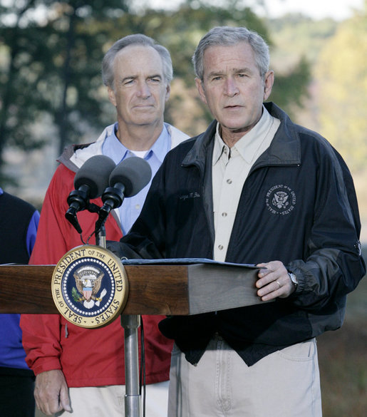 President George W. Bush, joined by U.S. Interior Secretary Dirk Kempthorne, addresses his remarks Saturday, Oct. 20, 2007 at the Patuxent Research Refuge in Laurel, Md., discussing the steps his Administration is creating for a series of cooperative conservation steps to preserve and restore critical stopover habitat for migratory birds in the United States. White House photo by Eric Draper