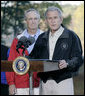 President George W. Bush, joined by U.S. Interior Secretary Dirk Kempthorne, addresses his remarks Saturday, Oct. 20, 2007 at the Patuxent Research Refuge in Laurel, Md., discussing the steps his Administration is creating for a series of cooperative conservation steps to preserve and restore critical stopover habitat for migratory birds in the United States. White House photo by Eric Draper