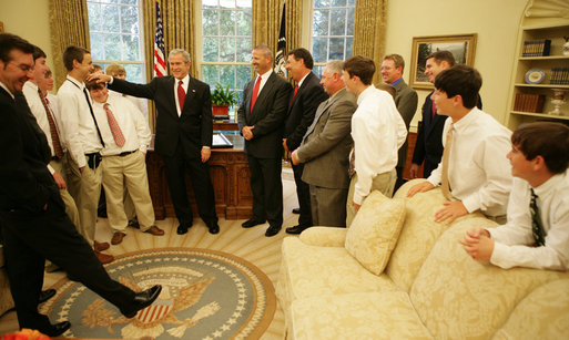 Members of the World Series Champion, Warner Robins, Georgia Little League team break out in laughter as President George W. Bush rubs the head of first baseman Micah Wells during a visit Thursday, Nov. 1, 2007, to the Oval Office. The 12-year-old went 1 for 3 in the team's 3-2 championship win over Japan. White House photo by Eric Draper
