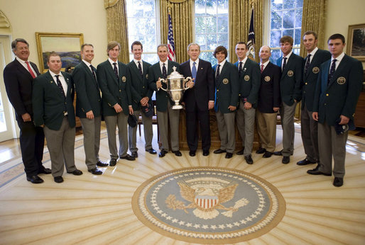 President George W. Bush stands with members of the U.S. Walker Cup in the Oval Office during their visit Monday, Nov. 5, 2007, to the White House. Named for the President's great grandfather, George Herbert Walker -- President of the United States Golf Association in 1920 -- the team defeated Great Britain and Ireland this past September to win the 41st Cup match. White House photo by Eric Draper