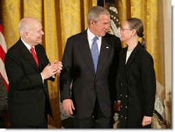 President George W. Bush congratulates C-SPAN founder Brian Lamb and his wife Victoria during the presentation of the Presidential Medal of Freedom Monday, Nov. 5, 2007, in the East Room. "For nearly 30 years, the proceedings of the House of Representatives have been televised -- unfiltered, uninterrupted, unedited, and live," said the President. "For this we can thank the Cable-Satellite Public Affairs Network, or C-SPAN. And for C-SPAN, we can thank a visionary American named Brian Lamb." White House photo by Eric Draper