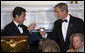 President George W. Bush and President Nicolas Sarkozy of France raise their glasses in toast Tuesday, Nov. 6, 2007, during dinner in the State Dining Room in the honor of the French leader. White House photo by Chris Greenberg