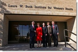 Mrs. Bush shakes hands with Chancellor Kent Hance, Texas Tech University System, as she stands with Dr. Marjorie Jenkins, Erin Thurston and Dr. John Baldwin in front of the Laura W. Bush Institute for Women's Health at TTU, Amarillo Campus Wednesday, Nov. 7, 2007, in Amarillo, Texas. White House photo by Shealah Craighead