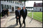 President George W. Bush and President Nicolas Sarkozy of France walk a path from George Washington's mansion during their tour Wednesday, Nov. 7, 2007, of the first president's home. White House photo by Eric Draper