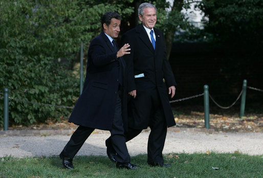 President George W. Bush and President Nicolas Sarkozy share a moment as they walk to a joint press availability Wednesday, Nov. 7, 2007, at Mount Vernon. The tour of the Virginia home of George Washington coincided with a series of meetings by the two leaders during the visit by the French leader to the United States. White House photo by Chris Greenberg